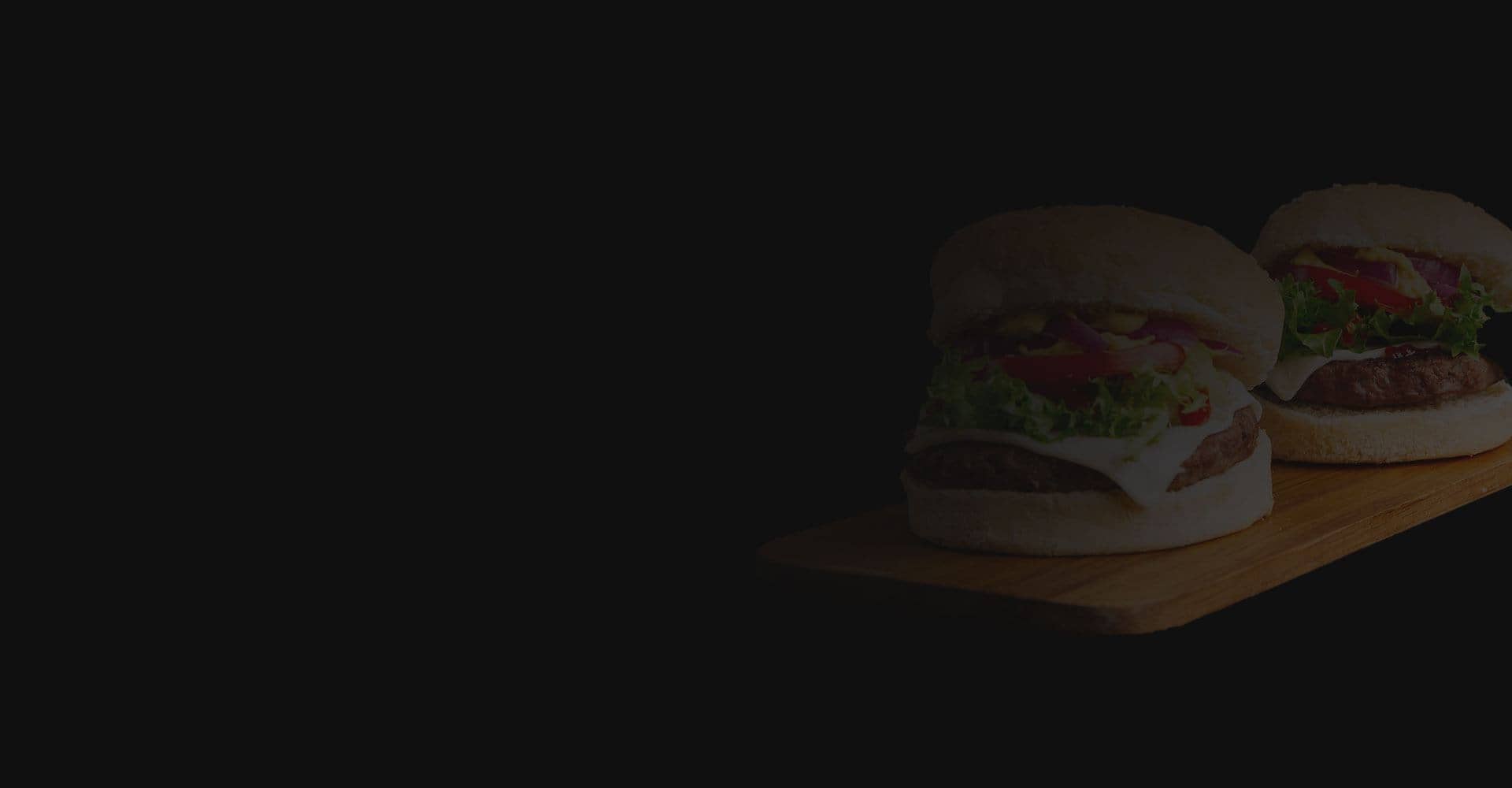 Burger and fries on a wooden table
