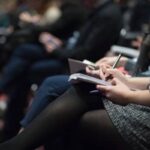 Attendees networking at the conference venue