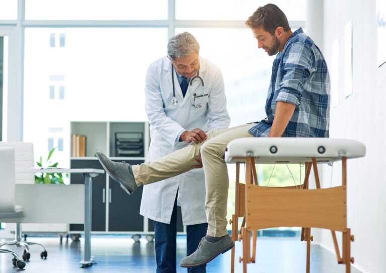 Orthopedic surgeon assessing a knee injury
