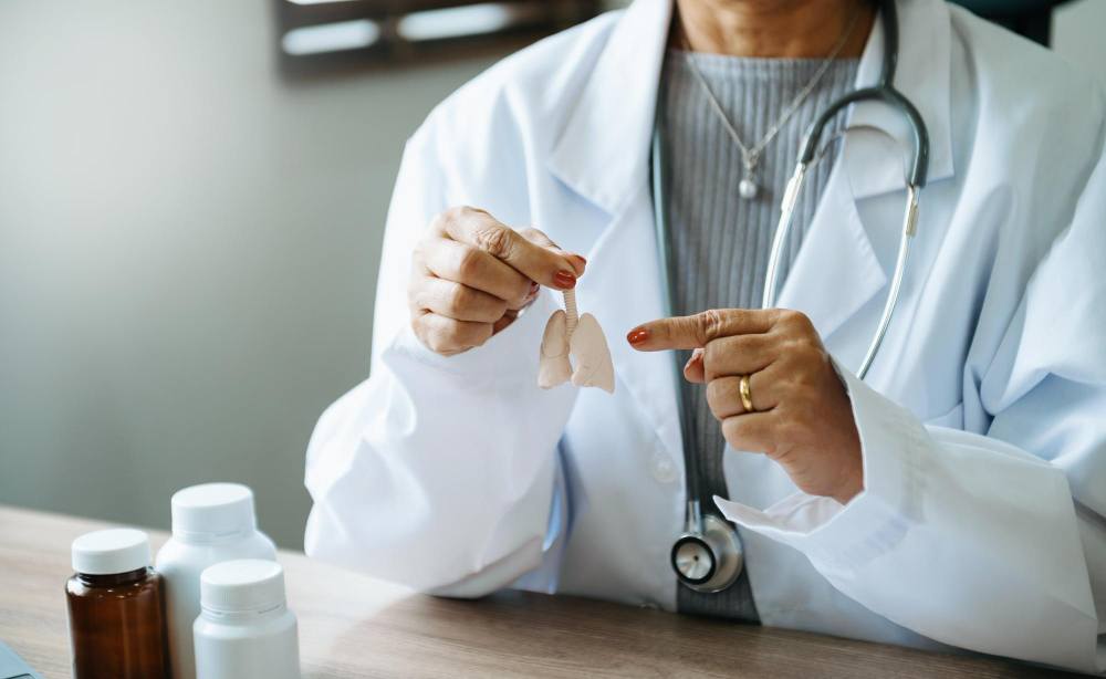 Pulmonologist listening to a patient’s breathing