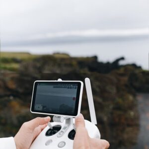 Drone controllers on a studio backdrop
