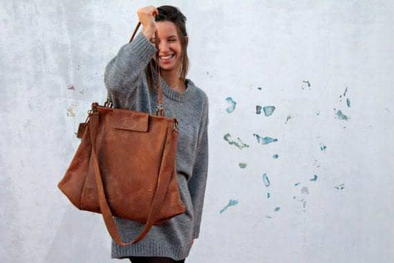 Woman carrying a brown leather tote