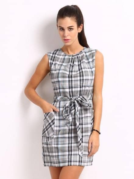 Model in a checked shift dress