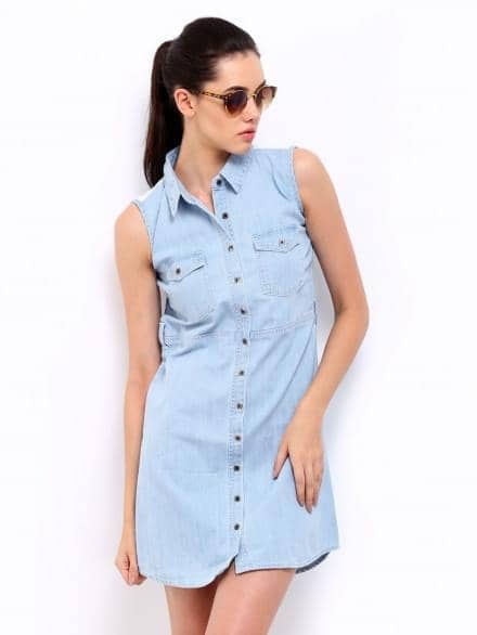 Model in a light blue denim dress