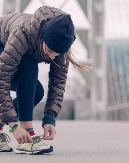 Runner lacing a pair of trainers