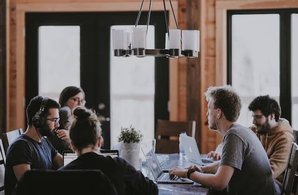 A team working together around a long table