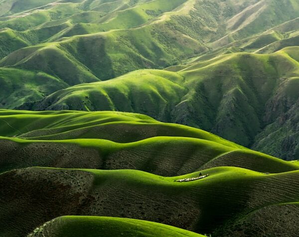 Green ridgelines rolling away into the distance