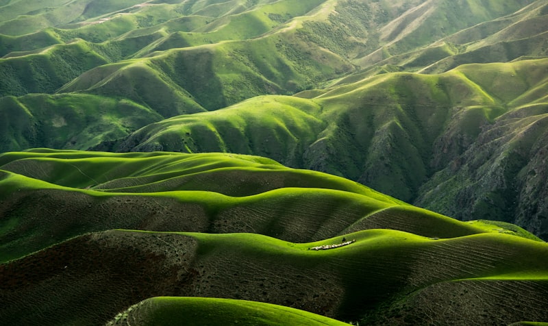 Green ridgelines rolling away into the distance