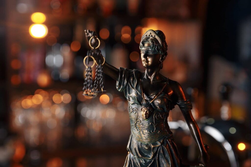 Bronze statue of Lady Justice, blindfolded and holding scales