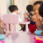 Children receiving learning materials through donation drive