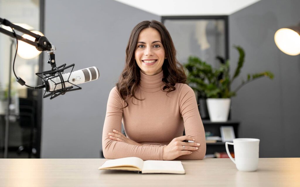 Host at the studio microphone with her notes