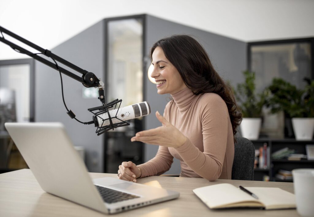 Podcaster speaking into a studio microphone
