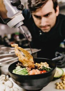 Chef preparing a signature dish